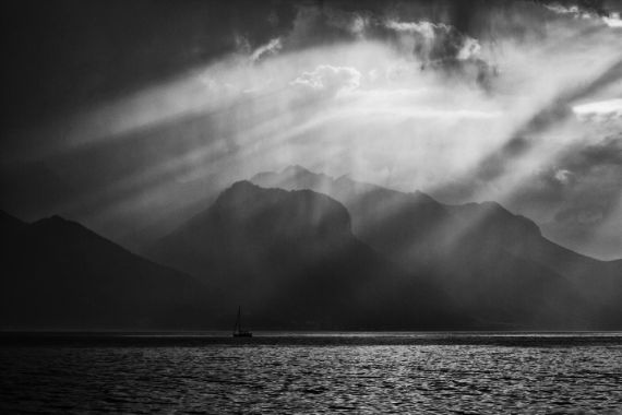 sailboat with mountains in background