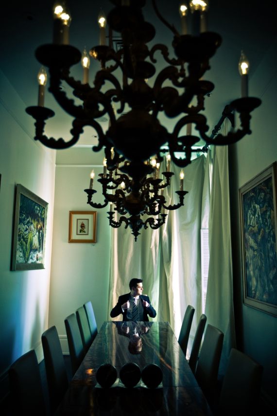 Groom sitting at table before wedding