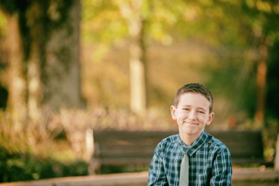 child posing for photograph