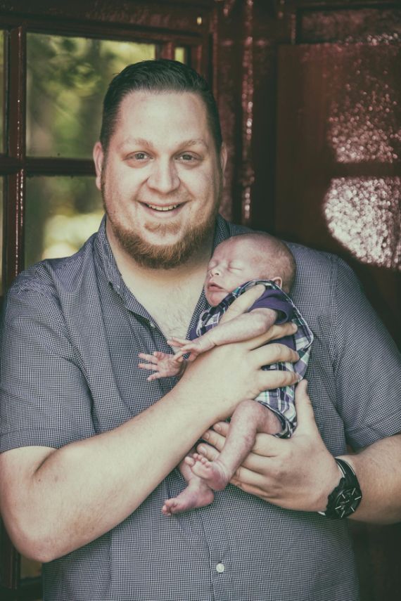 Happy father with newborn