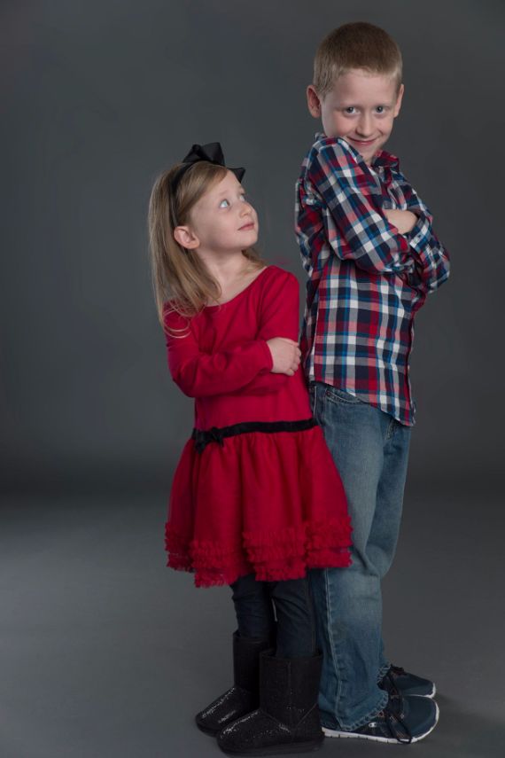 brother and sister with arms crossed